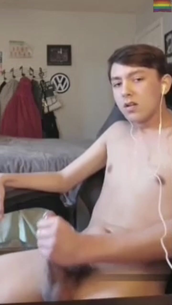 Solo gay twink flexes his muscles